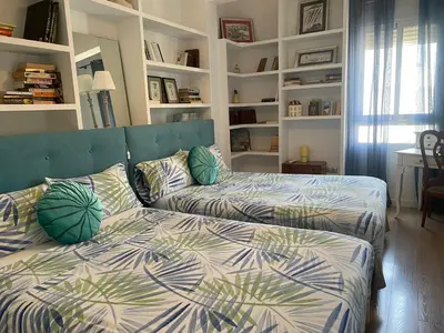 a bedroom with two beds with pillows on it at Valencia Sky Haven in Valencia