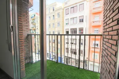 a balcony with a view of a building at Big Flat Ruzafa in Valencia