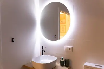 a bathroom with a white sink and a mirror at Apartment Casa Novi - Close to Beach, City Center & Metro in Valencia