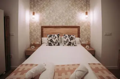 a bedroom with a large bed with two pillows at Nuevo y acogedor loft en Amistat in Valencia