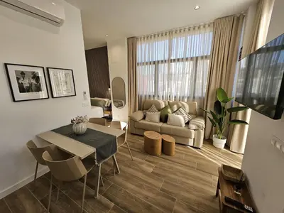 a living room with a couch and a table at HOB Las Ciencias Terrace II in Valencia