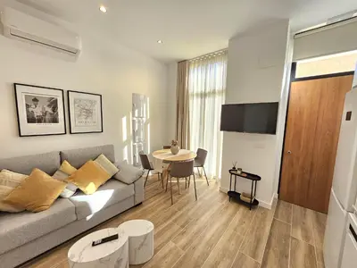 a living room with a couch and a table at HOB Las Ciencias I in Valencia