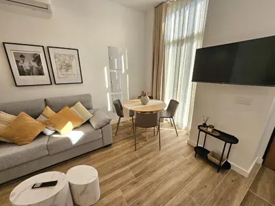 a living room with a couch and a table at HOB Las Ciencias I in Valencia