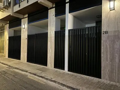 a building with black gates on the side of a street at HOB Las Ciencias Terrace III in Valencia