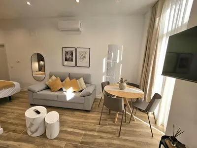a living room with a couch and a table at HOB Las Ciencias Terrace III in Valencia