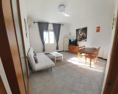a kitchen with a stove and a microwave at Habitación Matrimonio en vivienda para compartir recién reformada in Valencia