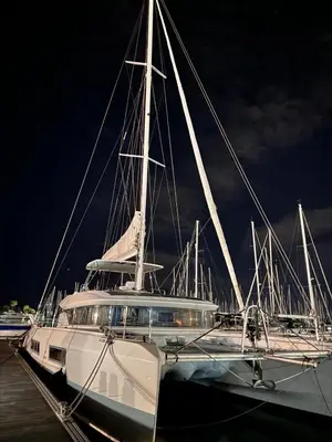 a white boat docked in a harbor at night at Patagonia in Valencia