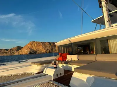 a boat sitting on the water with a bottle of wine at Patagonia in Valencia