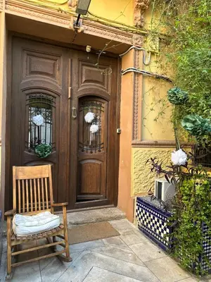 an open door to a patio with blue chairs at 1- Habitación interior con aire acondicionado y con baño independiente in Valencia