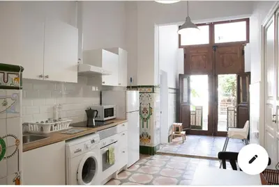 a white kitchen with a sink and a dishwasher at 1- Habitación interior con aire acondicionado y con baño independiente in Valencia