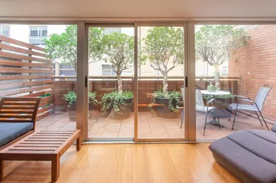 a living room with sliding glass doors and a patio at Loft Valencia centro - Vive el corazón de la ciudad in Valencia