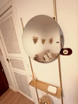 a mirror with three plants in a room at La Teja in Losa del Obispo