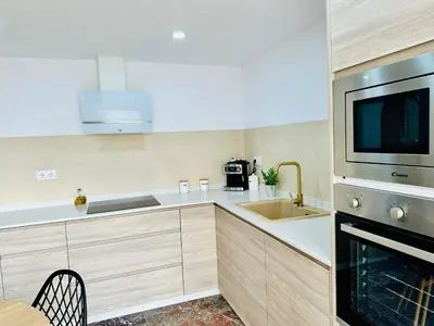 a kitchen with a sink and a microwave at La Roca in Losa del Obispo