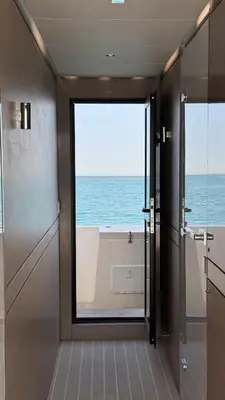 a kitchen cabinet with glasses and a toaster and bowls at Luxury Catamaran Stay in Valencia Marina in Valencia
