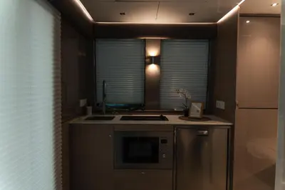 a kitchen with a stove and a sink and a refrigerator at Luxury Catamaran Stay in Valencia Marina in Valencia