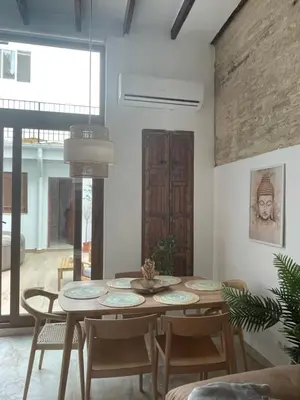 a dining room with a table and chairs at Dream Big with jacuzzi and terrace in Ruzafa in Valencia
