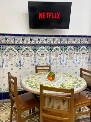 a table with chairs and a fruit on top of it at Casa del Cabanal La Playa Azul cobalto in Valencia