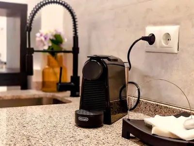 a hair dryer on a counter next to a lightswitch at Casa del Cabanal La Playa Azul cobalto in Valencia