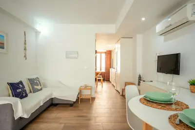 a living room with a couch and a table at Apto 2 P Ferrandis in Valencia