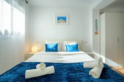 a bedroom with a large bed with towels on it at Apto 2 P Ferrandis in Valencia