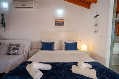 a bedroom with a large bed with two pillows at Apto 3 P Ferrandis in Valencia