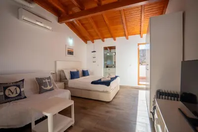 a living room with a bed and a couch at Apto 3 P Ferrandis in Valencia