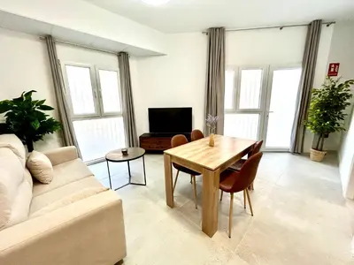 a living room with a couch and a table at Strategic Stay-Unlock Valencia's Best-Kept Secret in Valencia
