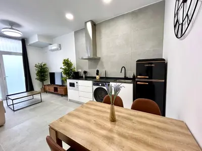 a kitchen with a table and a dining room at Valencia Urban Escape Comfort Meets Luxury, 4 Ppl in Valencia