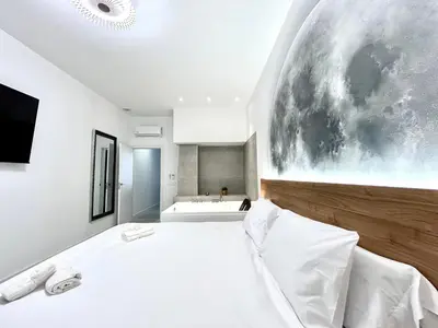 a bedroom with a large white bed and a large window at Valencia Urban Escape Comfort Meets Luxury, 4 Ppl in Valencia