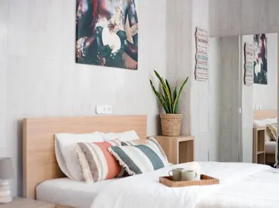 a bedroom with a bed with a tray on it at New Light Cozy Stay Ruzafa in Valencia
