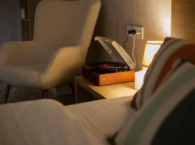 a bedroom with a bed and a desk with a lamp and a chair at New Light Cozy Stay Ruzafa in Valencia