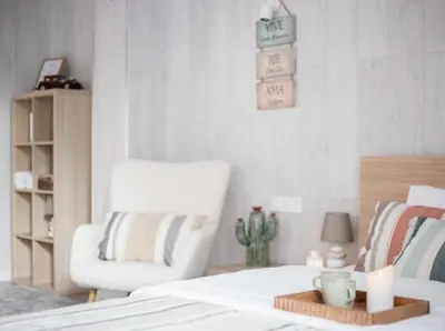 a bedroom with a white bed and a chair at New Light Cozy Stay Ruzafa in Valencia