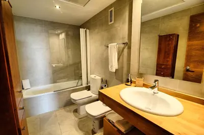 a bathroom with a sink and a toilet and a tub at Ohmyloft Valencia in Burjasot