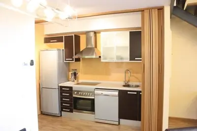 a kitchen with a white refrigerator and a sink at Ohmyloft Valencia in Burjasot