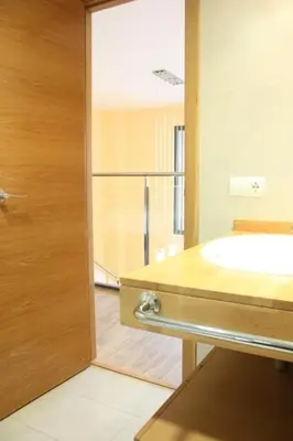 a bathroom with a sink and a glass shower at Ohmyloft Valencia in Burjasot