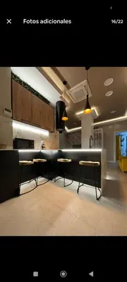 a kitchen with tables and chairs in a room at Apartamento ideal en calle florista in Valencia