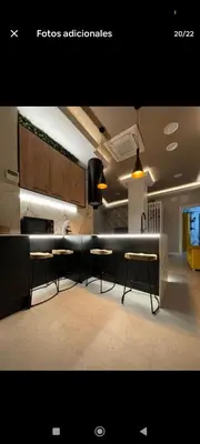 a kitchen with tables and chairs in a room at Apartamento ideal en calle florista in Valencia