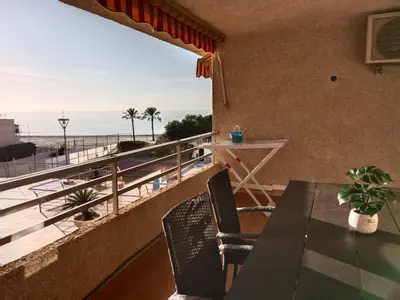 a balcony with a table and a view of the beach at Los Olivos BB1 in Faro de Cullera