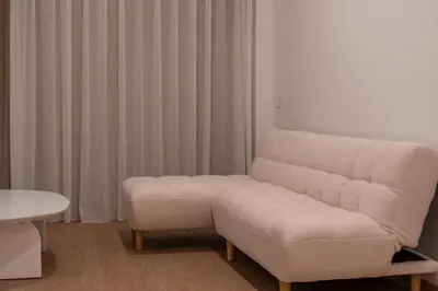 a living room with a couch and a chair at VLC HOST - Molinell in Valencia