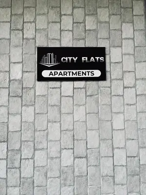a blanket sitting on the back of a bench at CITY FLATS - Avenida Baleares in Valencia