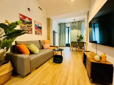 a living room with a couch and a table at ORI B Nice & Spacious Flat Close to the Center in Valencia
