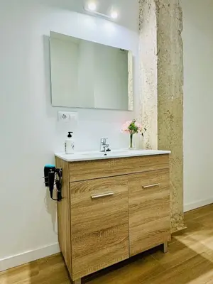 a bathroom with a sink and a mirror at ORI B Nice & Spacious Flat Close to the Center in Valencia