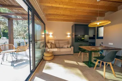 a living room with a table and chairs at Alojamiento Rural 1Respiro Parque Natural Serra Calderona in Serra