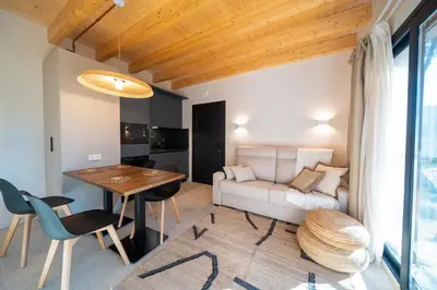 a living room with a table and a couch at Alojamiento Rural 1Respiro Parque Natural Serra Calderona in Serra