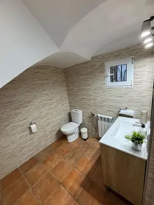 a bathroom with a toilet and a sink and a tub at Paraiso Natural Unico -Villa Cueva Turche in Valencia