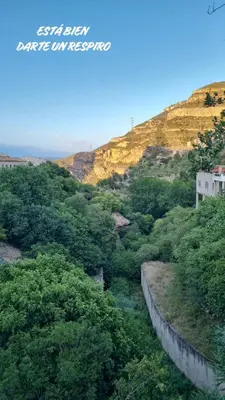 a view of a hill with trees and a river at Casa Centenaria en Cortes de Pallás in Cortez de Pallas