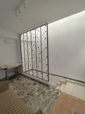 a room with a large window with a metal gate at Casa Centenaria en Cortes de Pallás in Cortez de Pallas