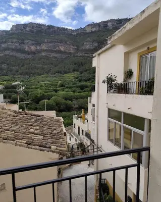 a view from the balcony of a building with mountains in the background at Casa Centenaria en Cortes de Pallás in Cortez de Pallas