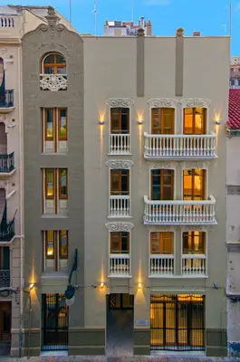 a building with white balconies on the side of it at Zalamera BnB in Valencia