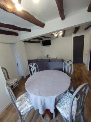 a dining room with a white table and chairs at Casa Rebel in Chelva